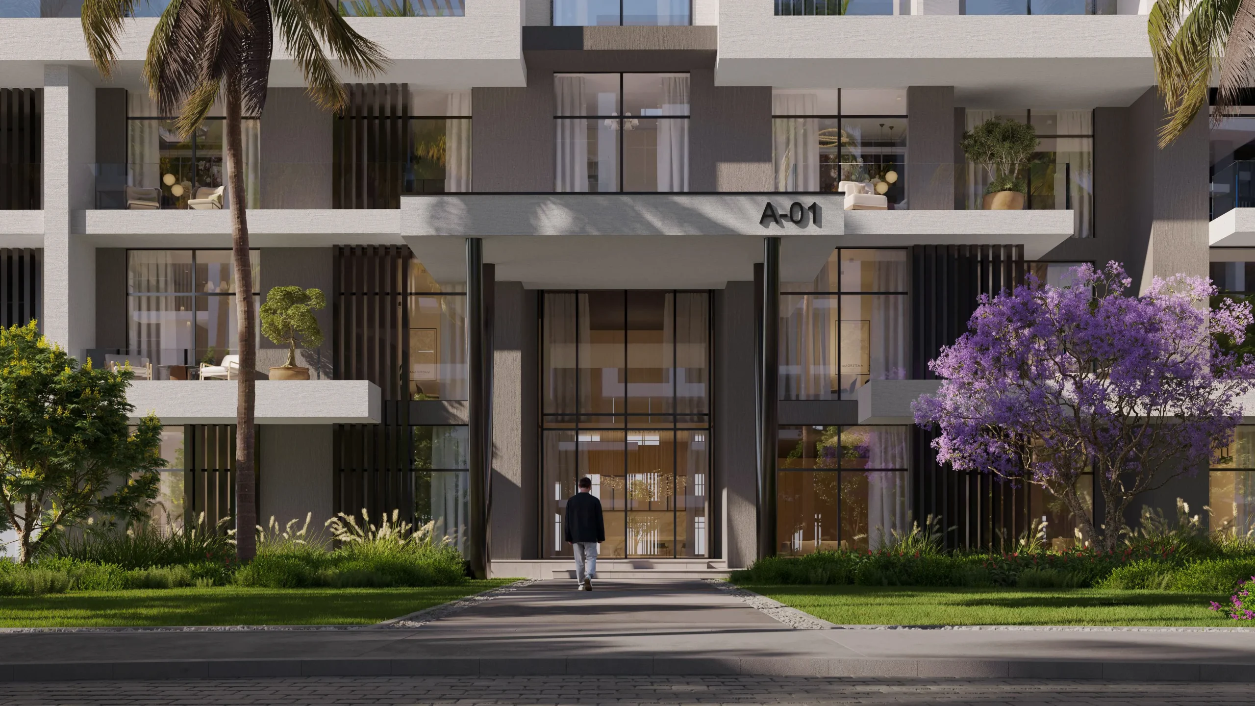 Entrance of Building A-01 at O{/NINE} — double-height portal framed by planting
