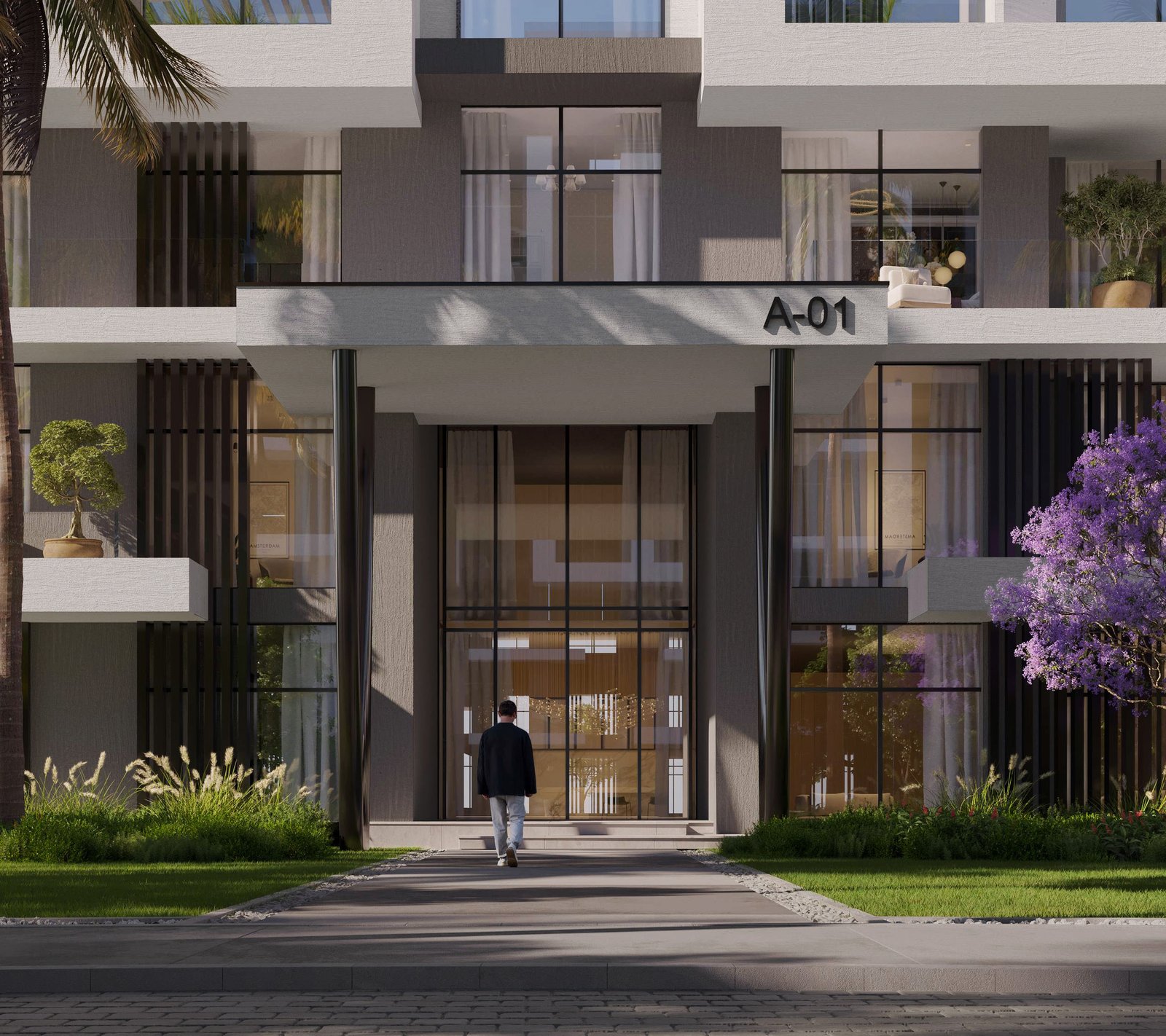 Entrance of Building A-01 at O{NINE} — double-height portal framed by planting