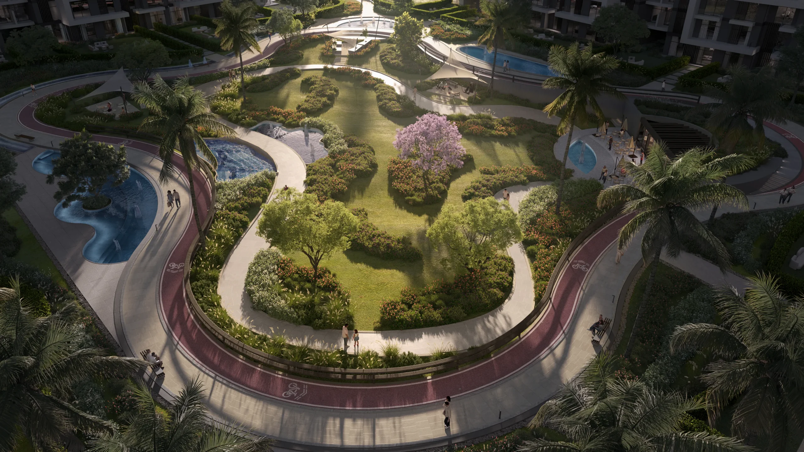 Aerial view of the central park at O{/NINE} with its jogging and cycling loops winding through greenery